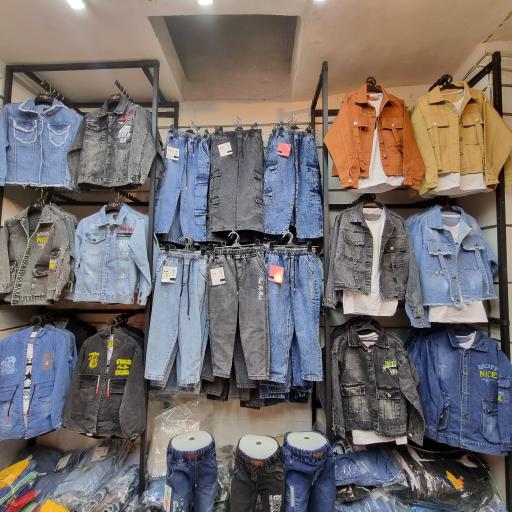 عکس فروشگاه پوشاک بچه گانه دُردونه