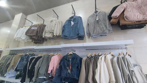 عکس فروشگاه لباس بچگانه سان کیدز