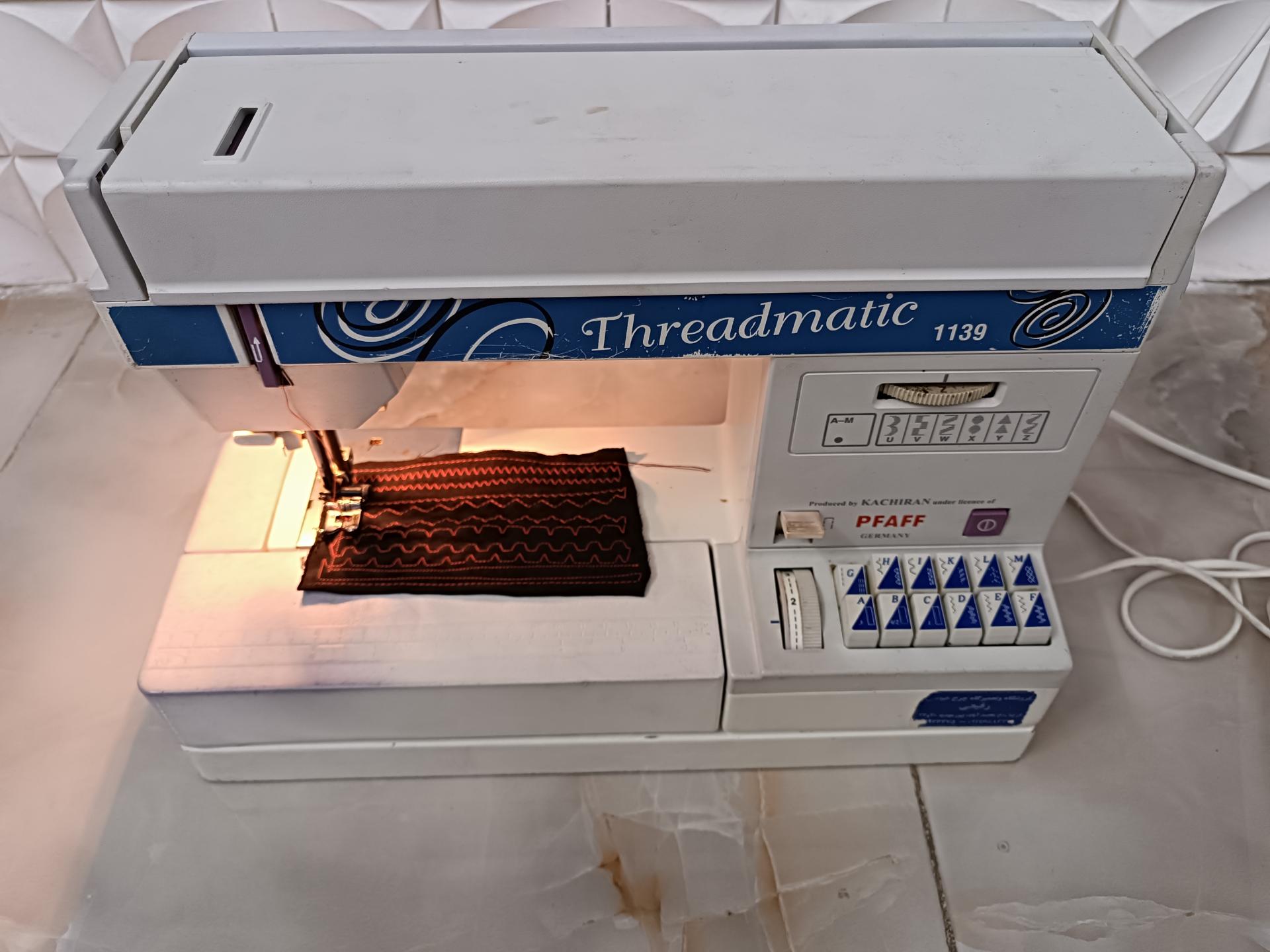 عکس تعمیر چرخ خیاطی صنعتی قیطانی