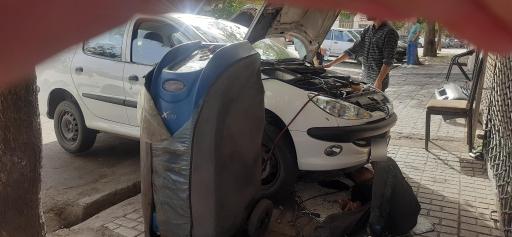 عکس تعمیرگاه کولر خودرو دنیای سرما