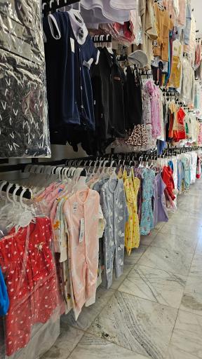 عکس فروشگاه لباس نوزاد و کودک نی نی ماه