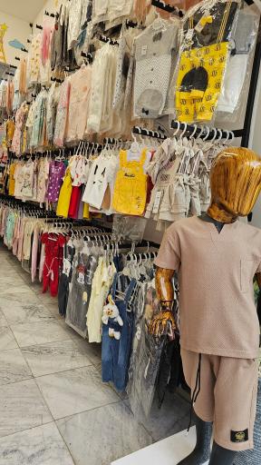 عکس فروشگاه لباس نوزاد و کودک نی نی ماه