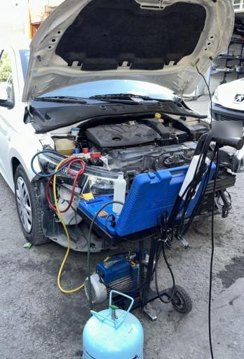 عکس باطری سازی تنظیم موتور و کولرسازی خلیلی