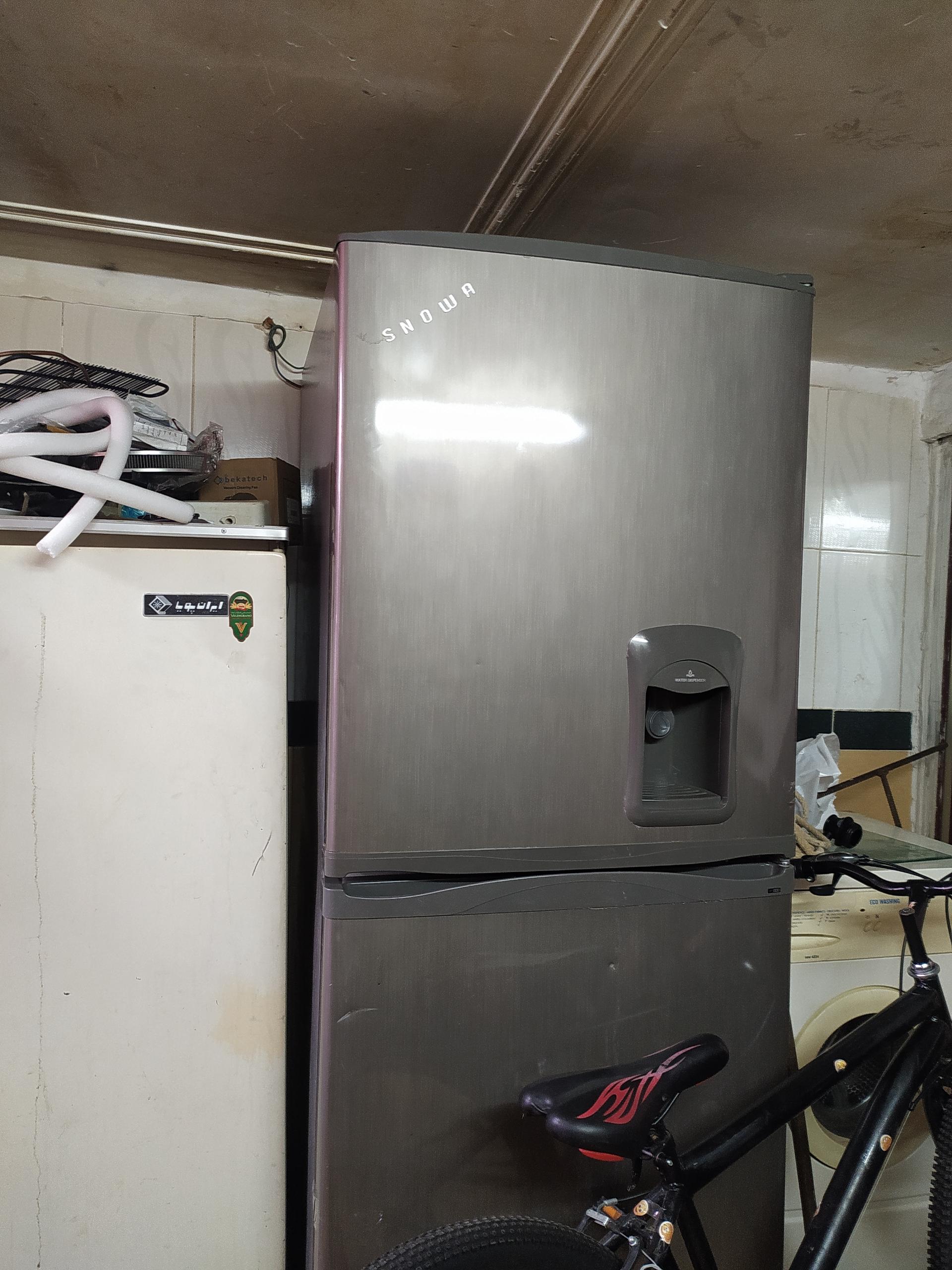 عکس تعمیر یخچال لباسشویی نوین