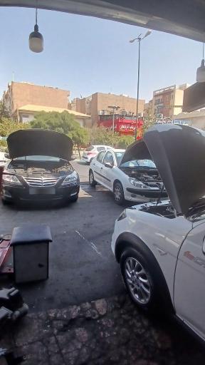 عکس بوستر سازی و تعمیرات ترمز اطمینان