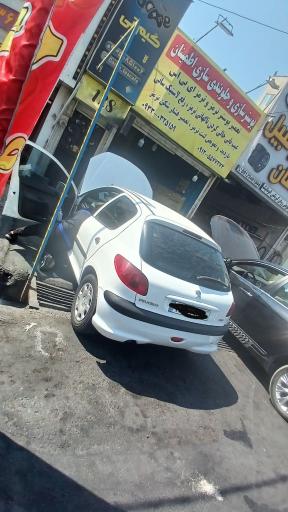 عکس بوستر سازی و تعمیرات ترمز اطمینان