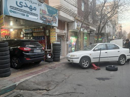 عکس تعویض روغنی و پنچرگیری مهدی