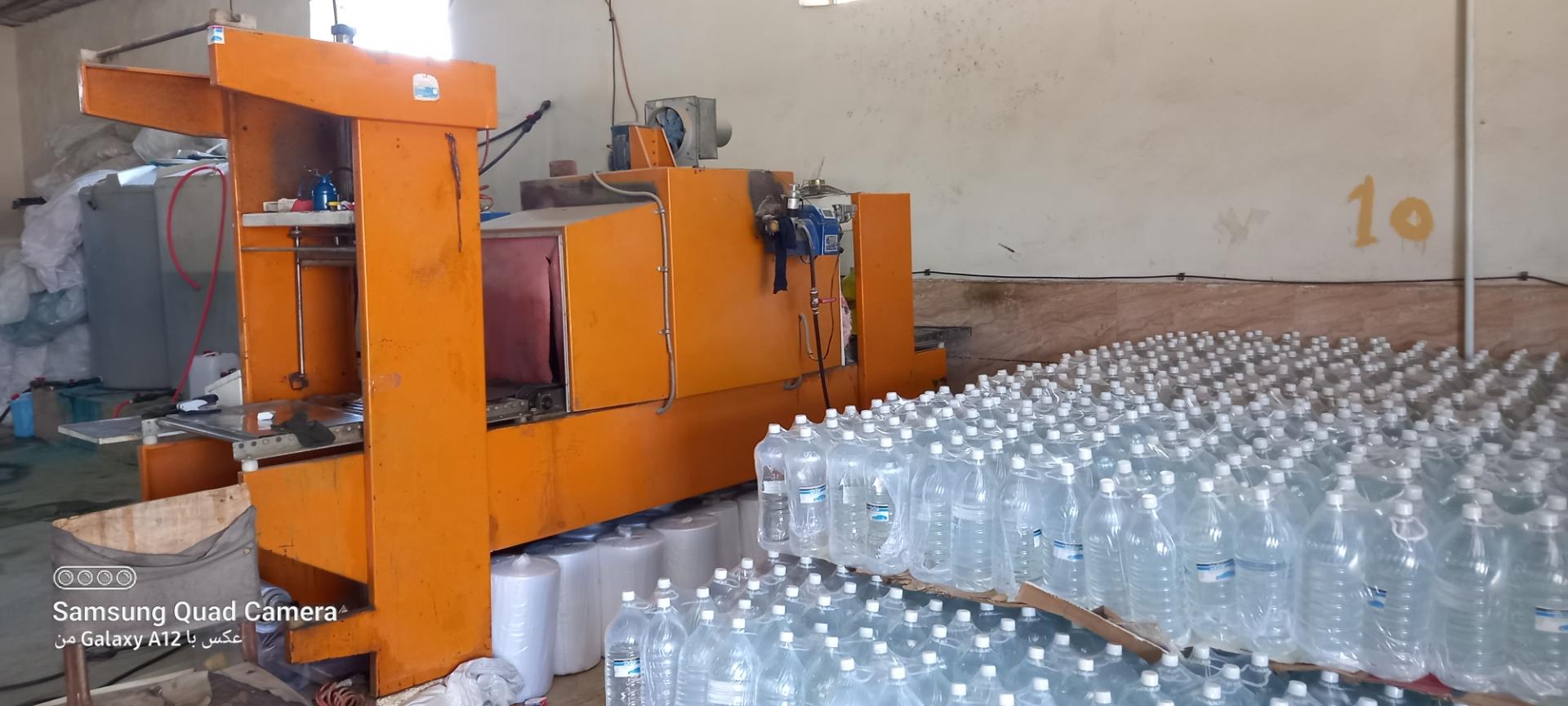 عکس کارخانه تولید انواع بطری و آب رادیاتور