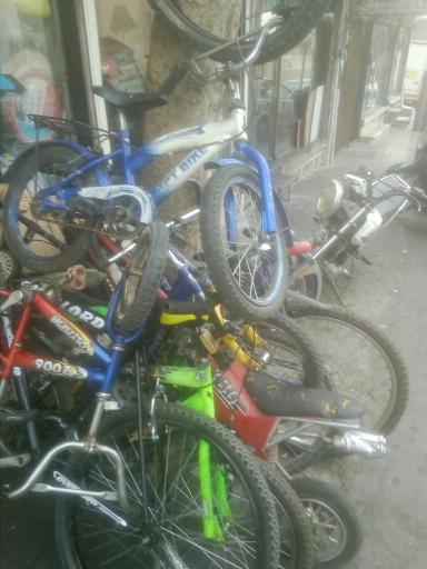 عکس تعمیرگاه دوچرخه و موتور سیکلت نوری