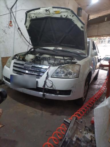 عکس تعمیرگاه مکانیکی تیک