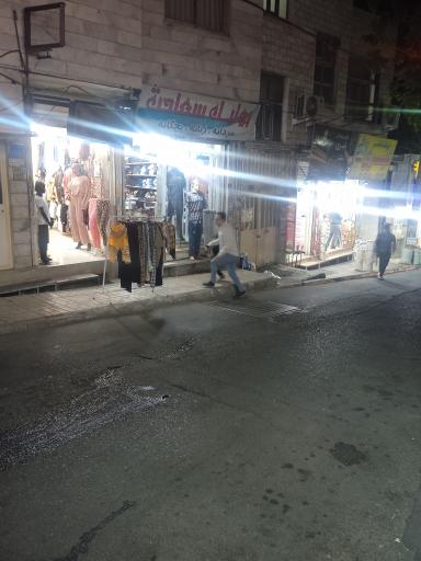 عکس بوتیک لباس زنانه و بچه گانه 