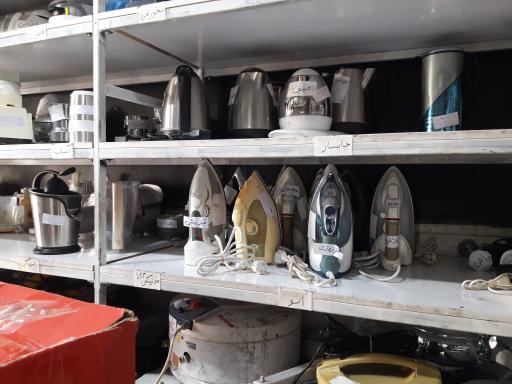 عکس فروشگاه بازسازی ظروف تفلون مالداران