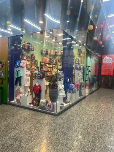 عکس فروشگاه لباس کودک سانلی کیدز