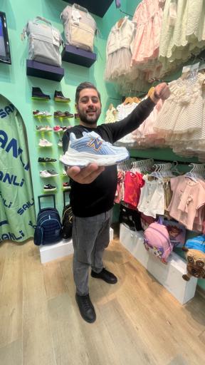 عکس فروشگاه لباس کودک سانلی کیدز