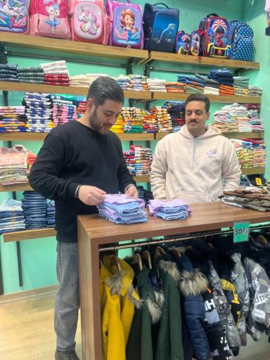 عکس فروشگاه لباس کودک سانلی کیدز