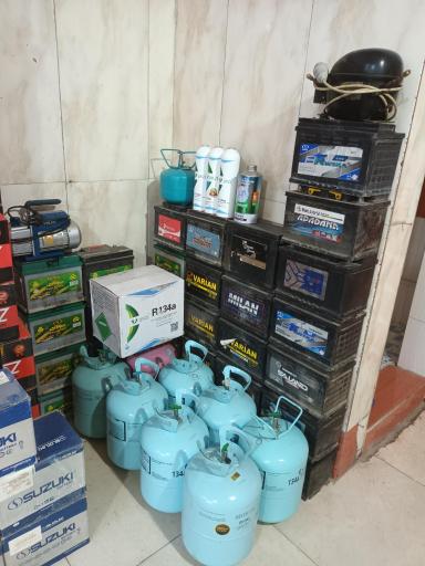 عکس باطری فروشی و شارژ گاز کولر فلاحی