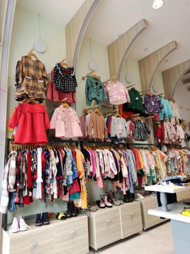 عکس فروشگاه لباس کودک تی تی گل