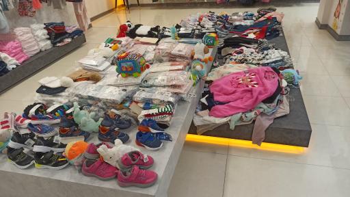 عکس فروشگاه لباس کودک لوپی