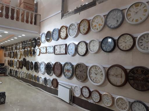 عکس تولید و پخش ساعت دیواری آونگ 