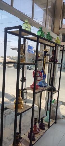 عکس پخش زغال تنباکو و موادغذایی احمد