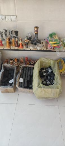 عکس پخش زغال تنباکو و موادغذایی احمد