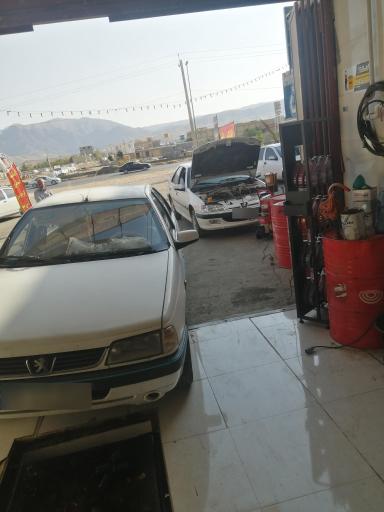 عکس تعویض روغن و پنچرگیری ماهور