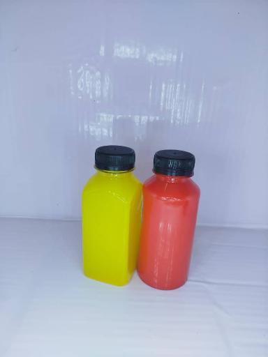 عکس تولید بطری های پلاستیکی آبمیوه و نوشیدنی 