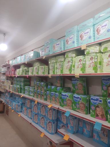 عکس فروشگاه پوشک بچه وبزرگسال مادر