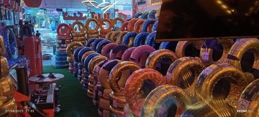 عکس بازرگانی رینگ و لاستیک آکو چمنی