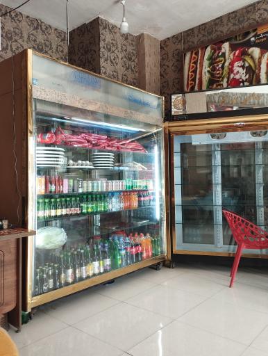 عکس ساندویچ و پیتزای دایی برگر