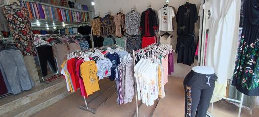 عکس ارزانسرای پوشاک تاج