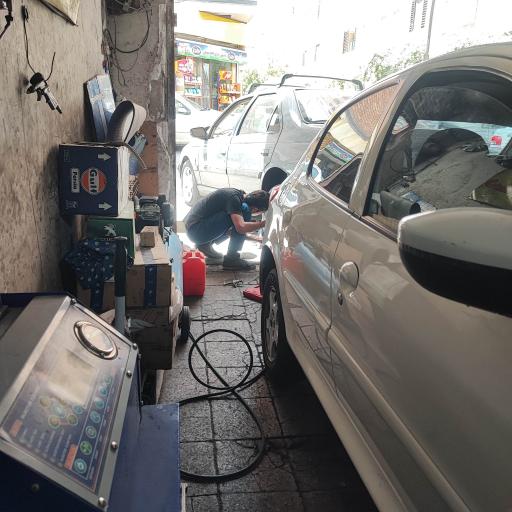 عکس مکانیکی آقا ایرج و پسران