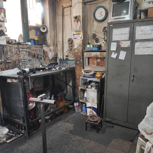 عکس مکانیکی آقا ایرج و پسران