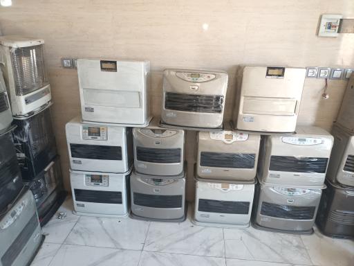 عکس تعمیرگاه بخاری نفتی وبرقی