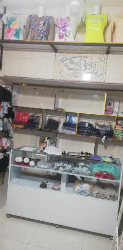 عکس پوشاک زنانه و بچگانه باران