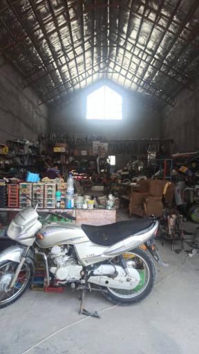 عکس فروشگاه و تعمیرگاه موتورسیکلت شهر مزایده