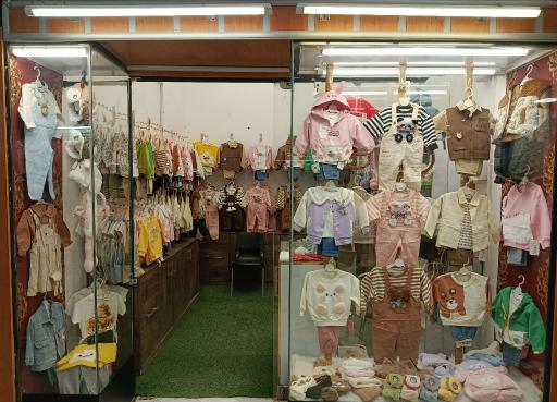 عکس فروشگاه لباس سایز باما