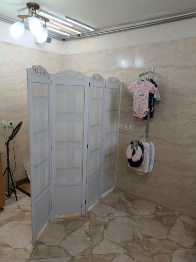 عکس ملیسک فروشگاه لباس بچگانه