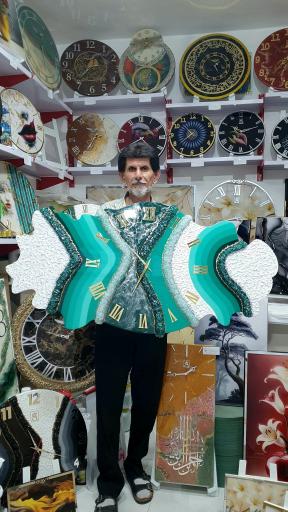 عکس ساعت دیواری رزینی سیاسیاهی