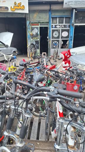 عکس تعمیر دوچرخه بهروز