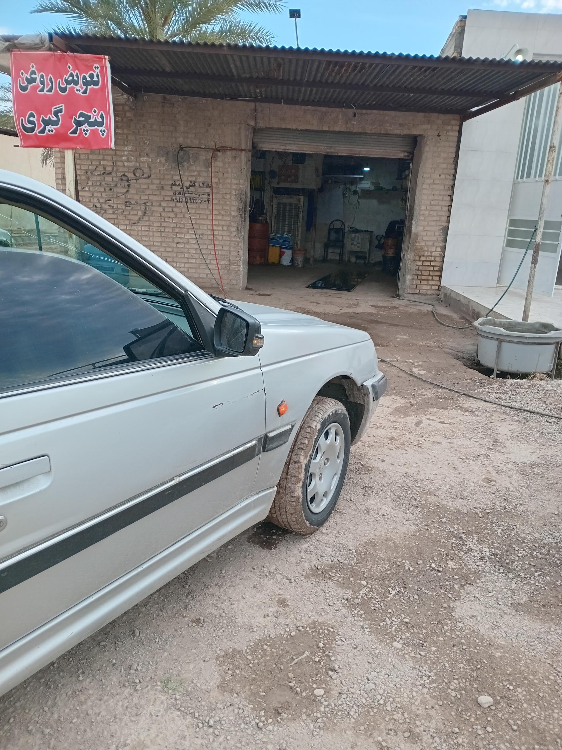 عکس تعویض روغن و پنچری گیری عادل بختیاری