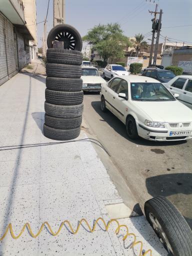 عکس فروش لاستیک و تنظیم باد