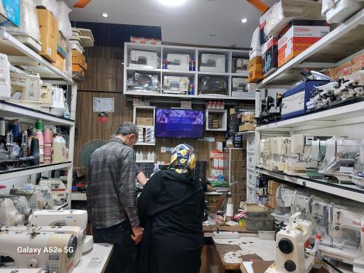 عکس تعمیرات چرخ خیاطی خزایی