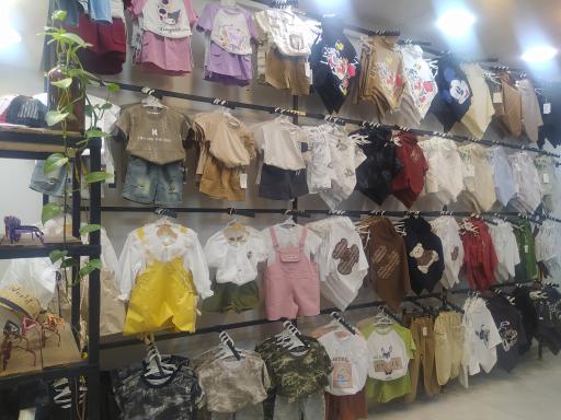 عکس پوشاک بچگانه توتیا 