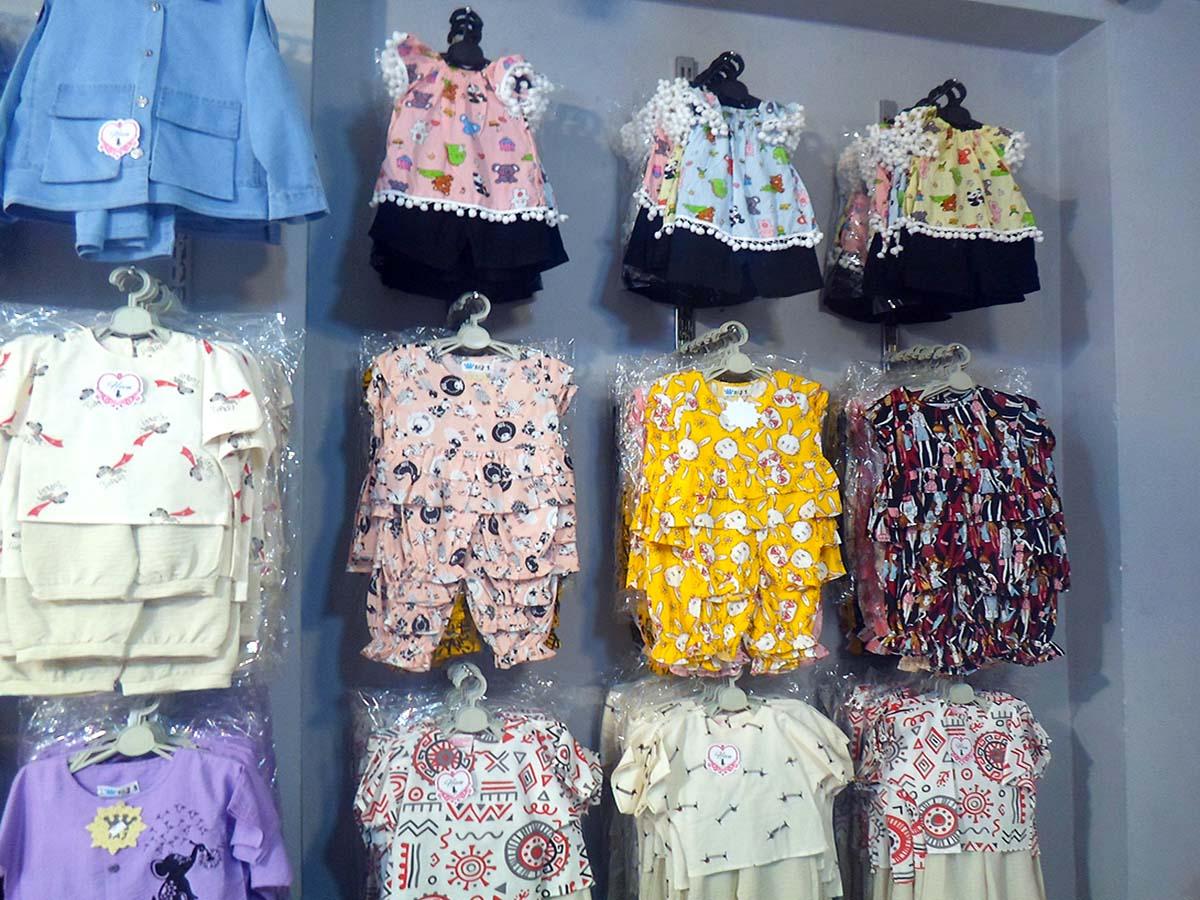 عکس تولید و پخش پوشاک لباس بچگانه زیگ زاگ