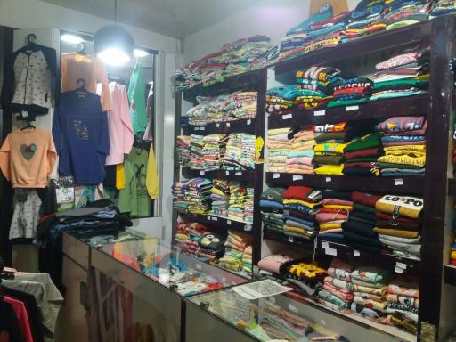 عکس فروشگاه لباس کودک بچه شیک