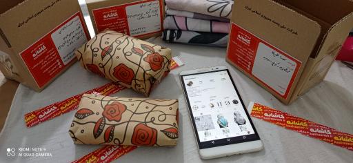 عکس فروشگاه شال و روسری کاشانه