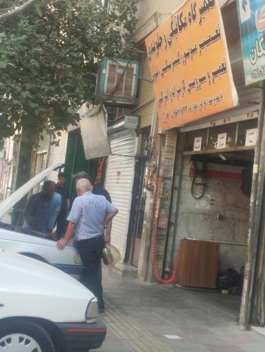 عکس تعمیرگاه مکانیکی و جلوبندی تنظیم موتور